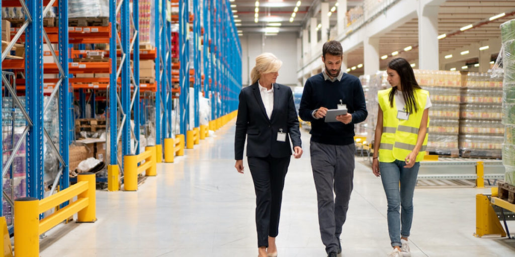 Team walking in warehouse